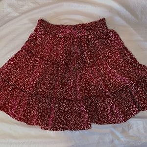 A Small Maroon/red skirt with white flowers!